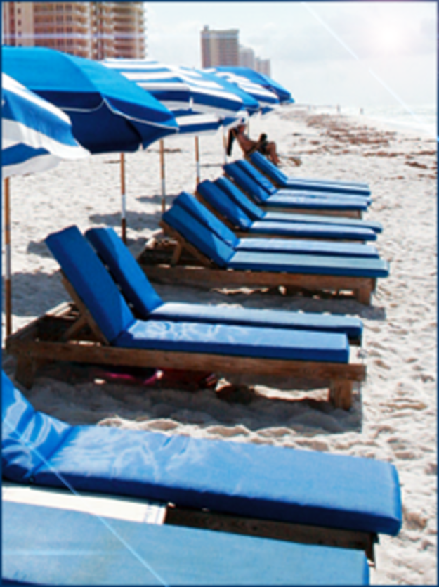 Blue sunbeds on the beach