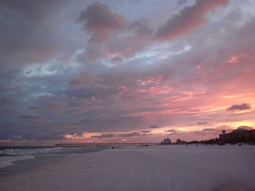 Pinky clouds over the beach