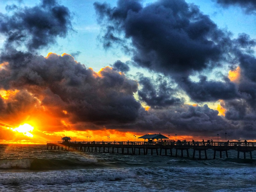 Clouds, sunset and fishing pier
