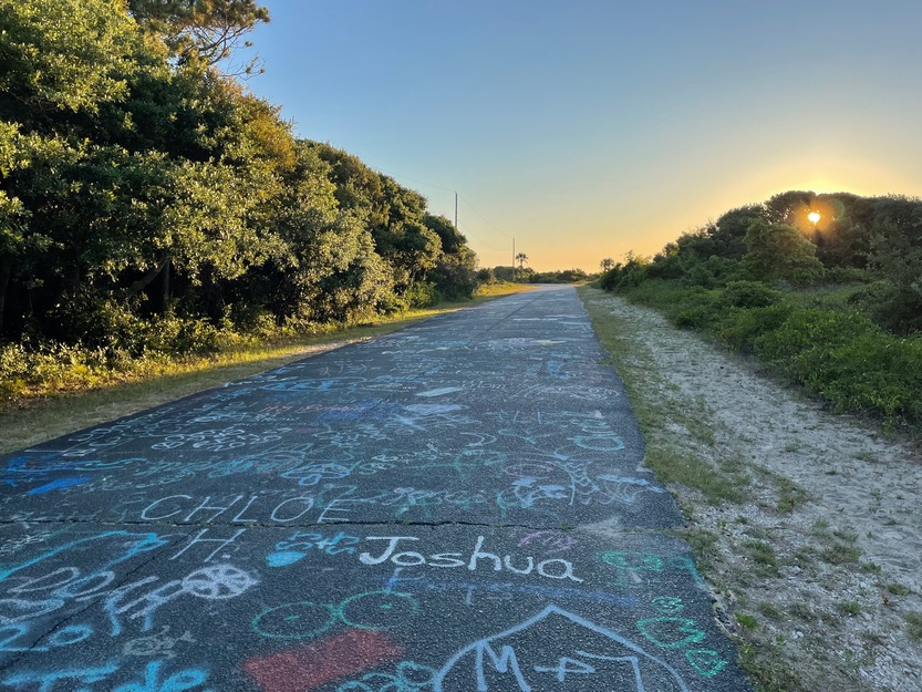 Graffitti road leading to Lighthouse Inlet Heritage Preserve Beach