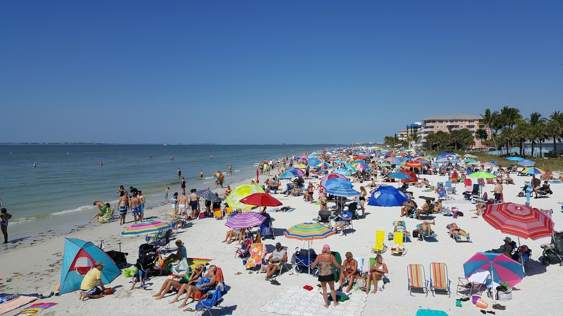 Crowds of people sunbathing on Fort Myers Beach