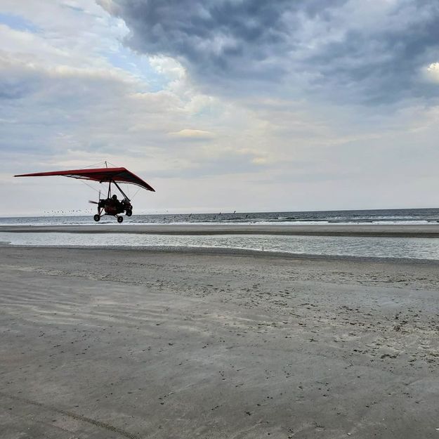 A hang-glider over the beach