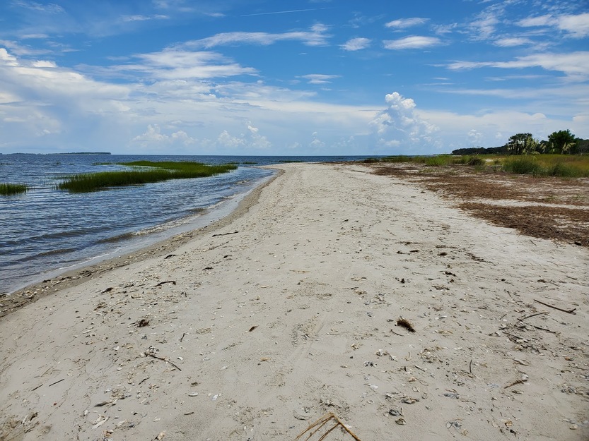 Narrow sandy beach strip