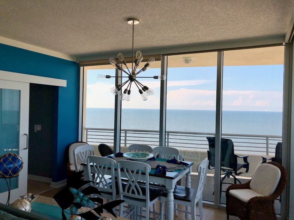 Floor To Ceiling Windows Overlook The Gulf Of Mexico's Pristine White Beaches photo