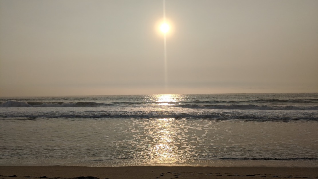 Sun shining over Elmar Beach CA