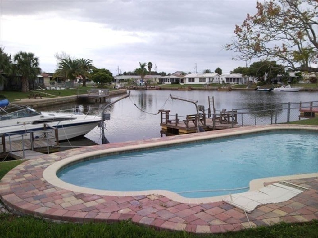 Quaint Waterfront Home with Heated Pool • Just 5 Minutes From the Beach photo