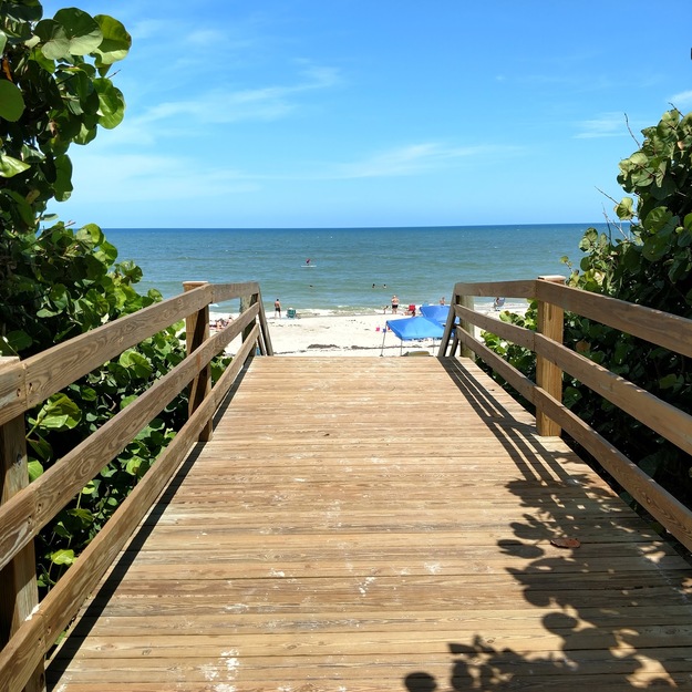 Wooden boardwalk leading to Eau Gallie Beach, FL