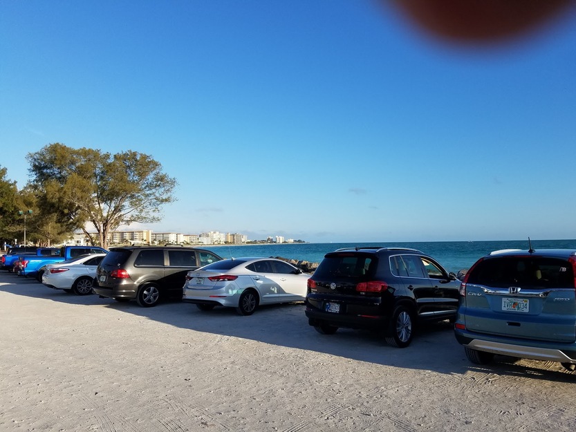 Cars parked near North Jetty Beach FL