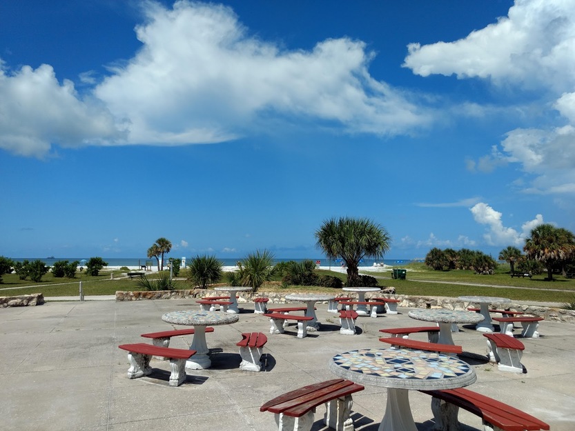 Tables and benches near the beach