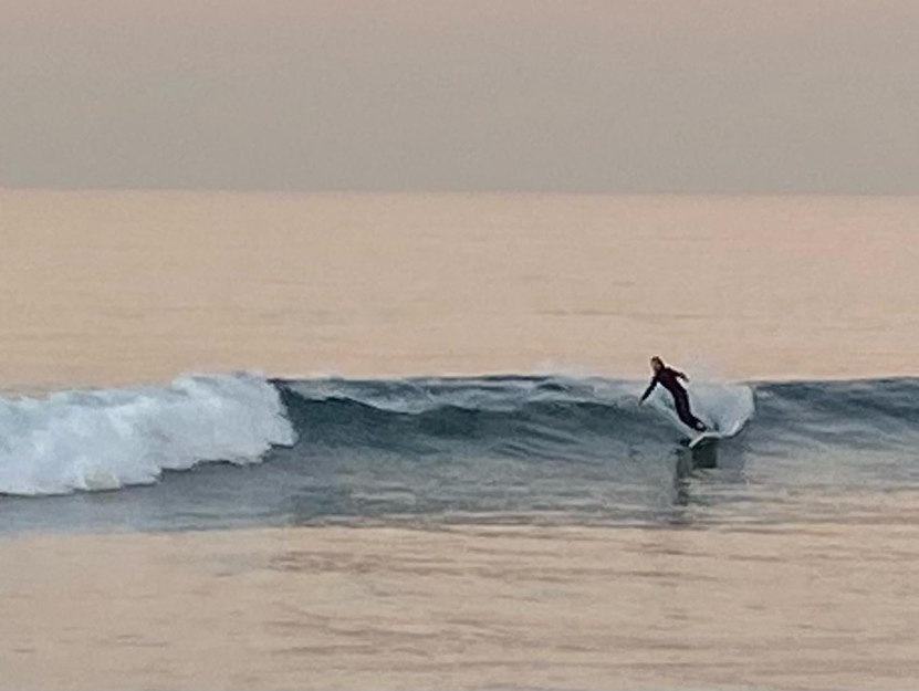 Surfer near Bolsa Chica State Beach CA