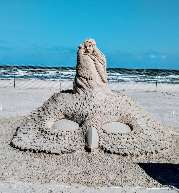 Sand figure on the beach