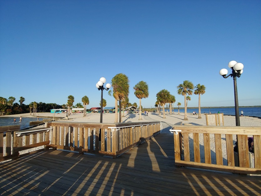 Wooden boardwalk on Alfred McKethan Pine Island Park Beach