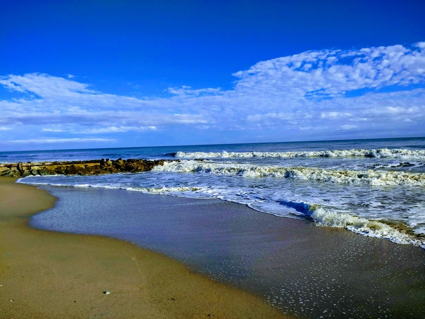 Deep blue sky and clouds over the beach