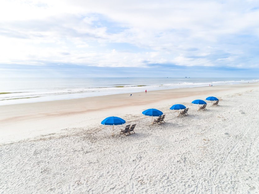 Blue umbrellas on the beach