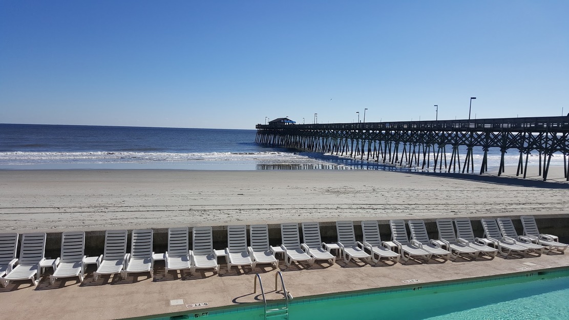 Sunbeds and fishing pier