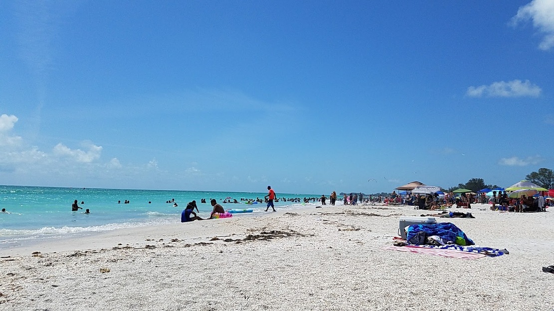 People sunbathing on Manatee Public Beach
