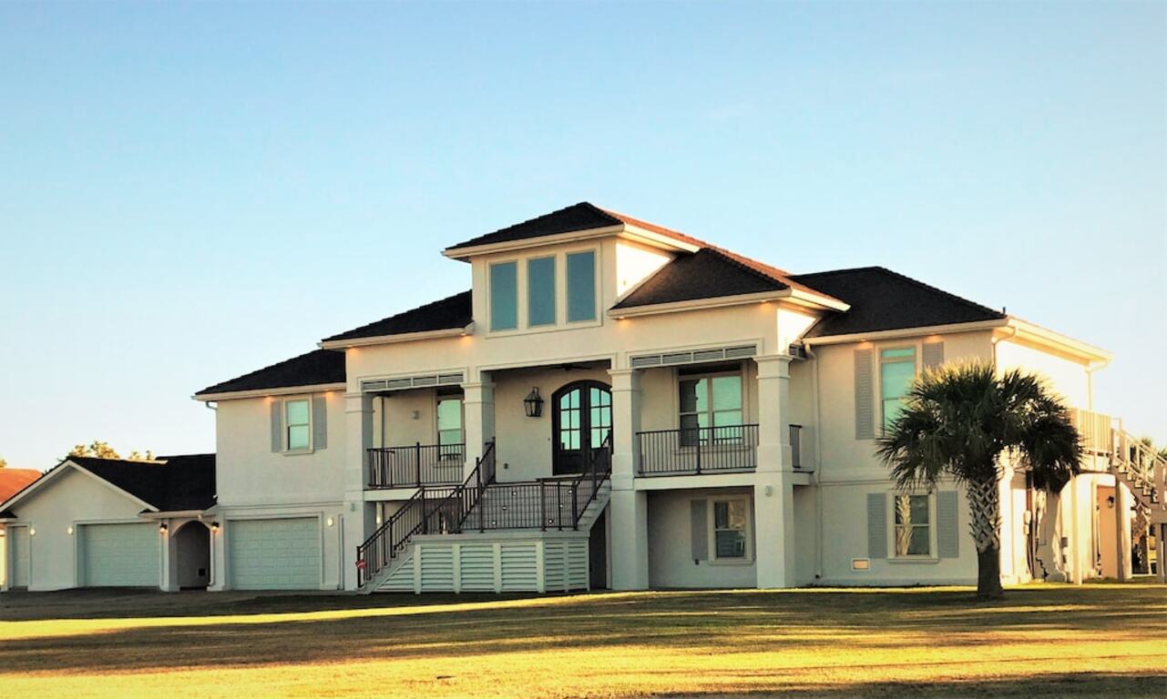 BEAUTIFUL WATERFRONT HOME WITH BOATHOUSE AND HUGE PORCHES! photo