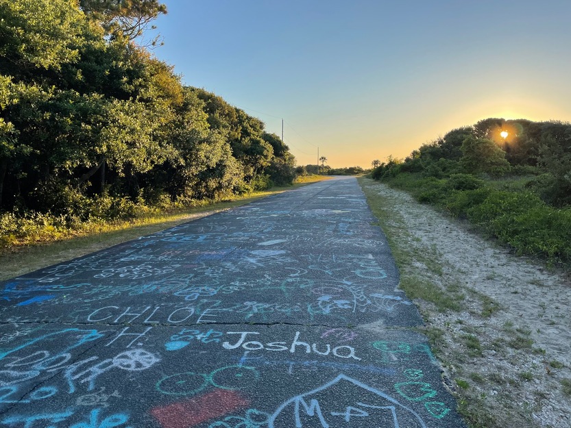 Graffitti road leading to Lighthouse Inlet Heritage Preserve Beach