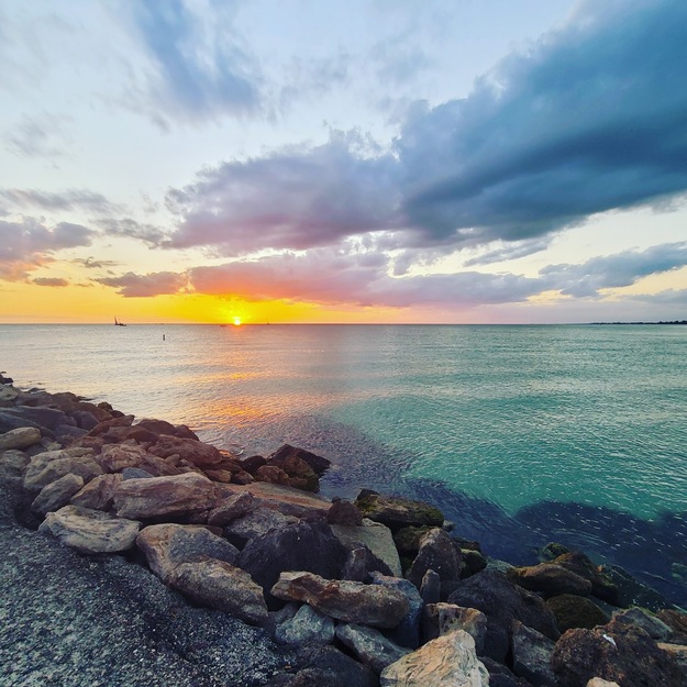 Sunset and rocks on North Jetty Beach