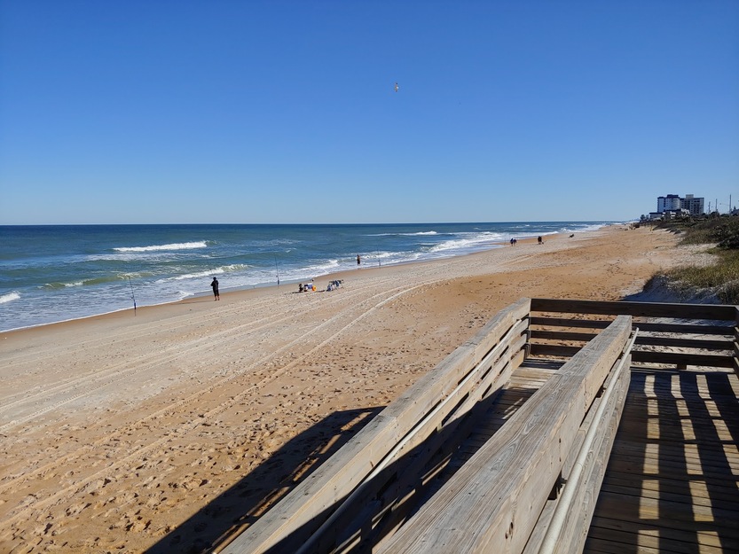 Wooden boardwalk on Michael Crotty Bicentennial Park Beach FL