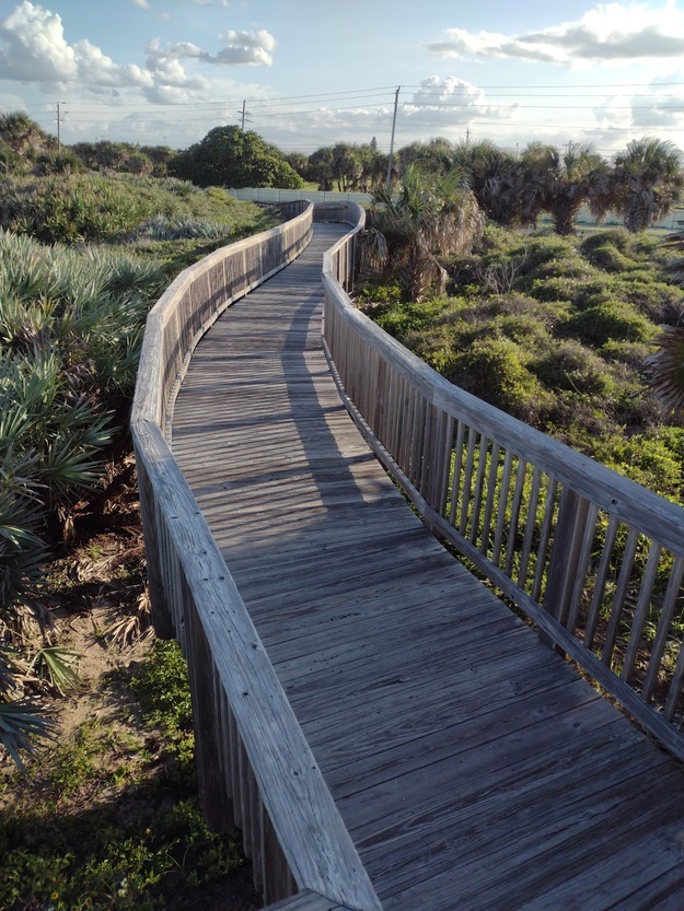 Wooden boardwalk in Hightower Beach Park FL
